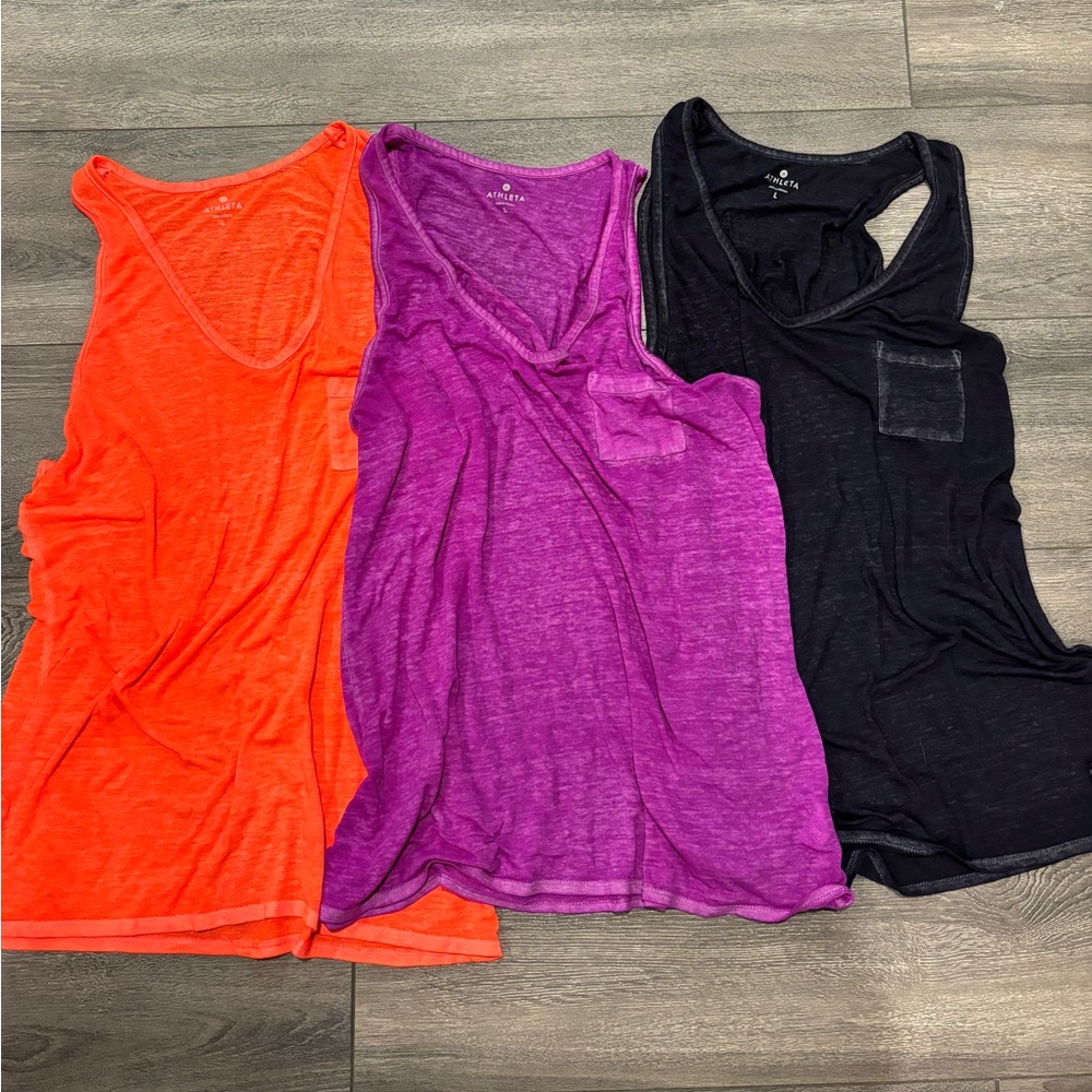 Three Athleta tank tops